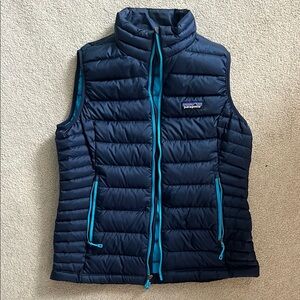 Patagonia Blue Puffer Vest with High Collar and Zipper Closure